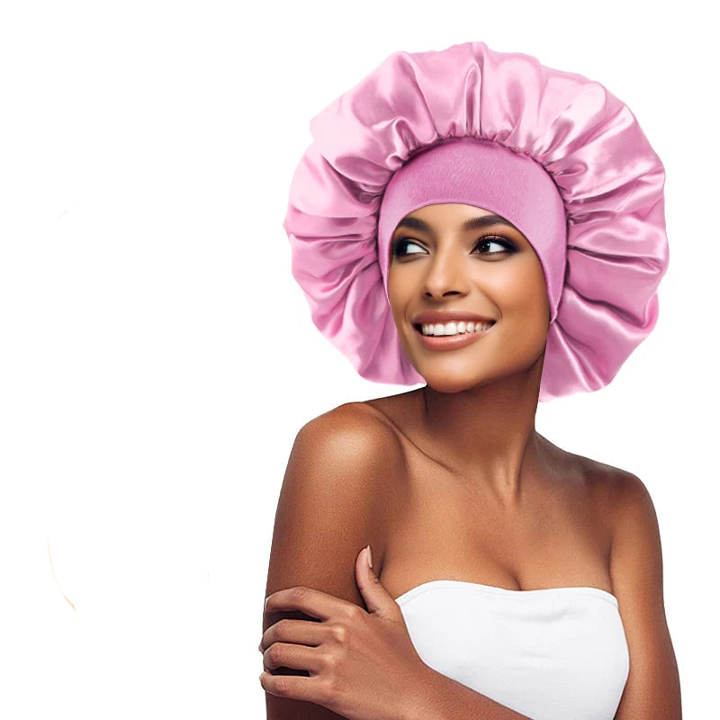 Woman wearing a pink satin bonnet with a close-up of the bonnet on a white background.