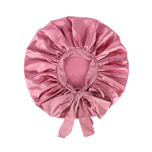 Adjustable Pink Satin Bonnet with long tie band – protects curly and natural hair while adding elegant style.