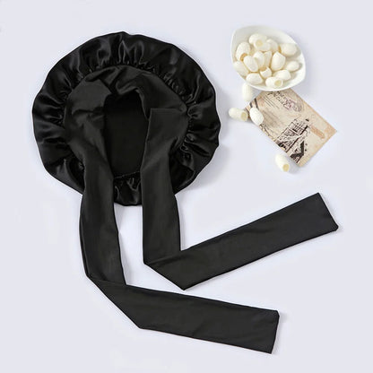 Pure mulberry silk sleeping bonnet designed to protect curly and textured hair overnight