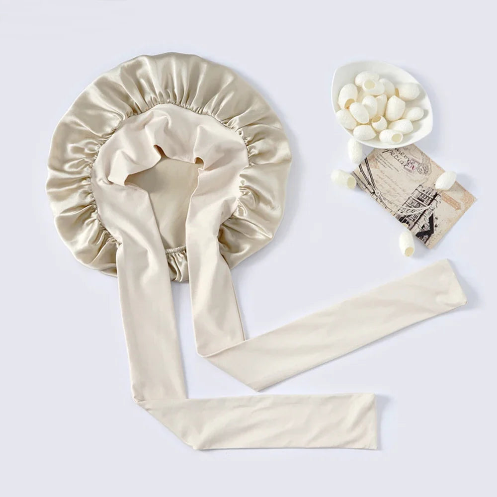 Pure mulberry silk sleeping bonnet designed to protect curly and textured hair overnight