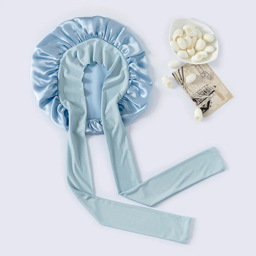 Pure mulberry silk sleeping bonnet designed to protect curly and textured hair overnight