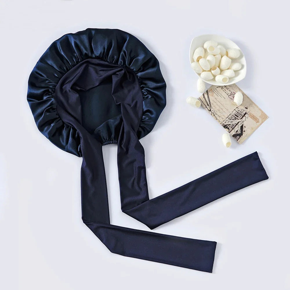 Pure mulberry silk sleeping bonnet designed to protect curly and textured hair overnight