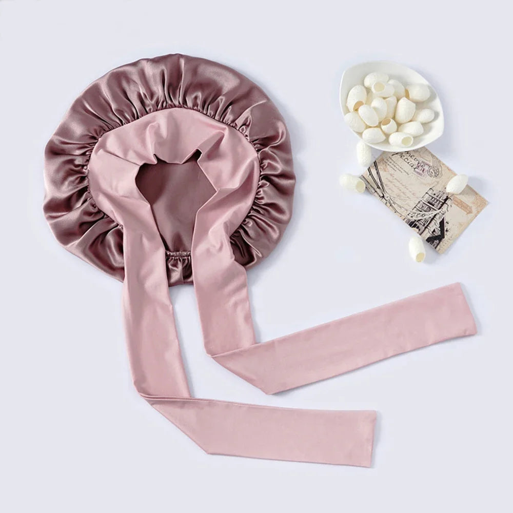 Pure mulberry silk sleeping bonnet designed to protect curly and textured hair overnight