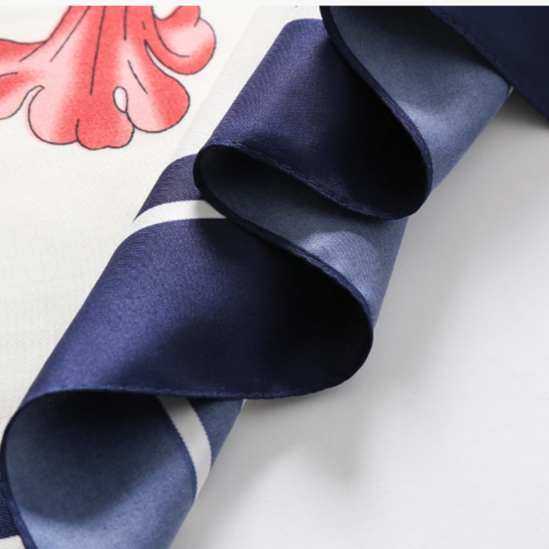 Navy border detail of twill silk scarf – elegant edge finish for a timeless look by Silkvana.